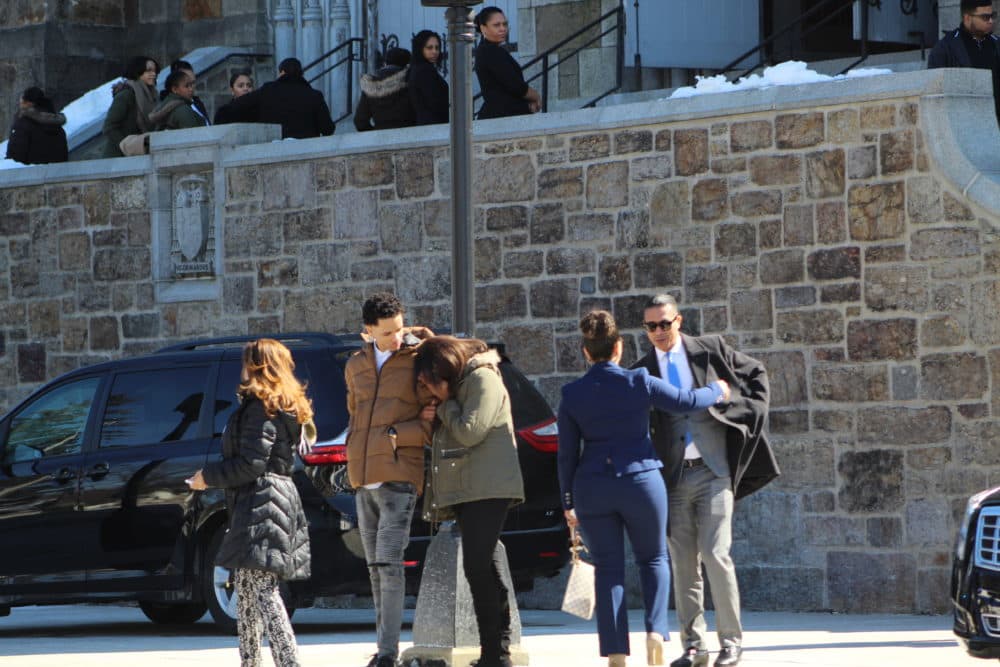 Mourners gather outside the funeral of Jassy Correia. (Quincy Walters/WBUR)