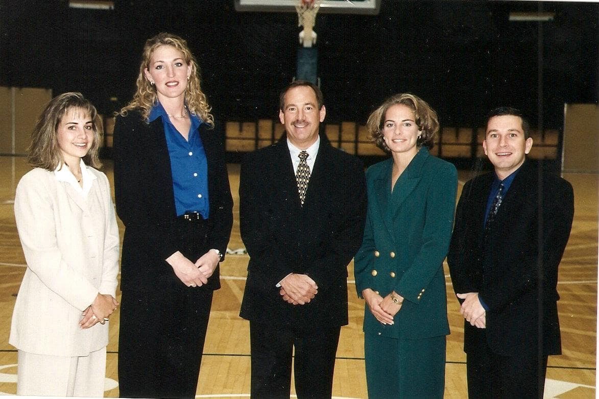 Tom (center) and Nicki (second from right) with the Colorado State women's basketball coaching staff in 1999. (Courtesy Nicki Collen)