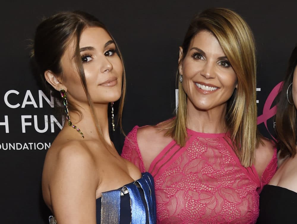 In this Feb. 28, 2019 file photo, actress Lori Loughlin poses with her daughter Olivia Jade Giannulli, left, at the 2019 &quot;An Unforgettable Evening&quot; in Beverly Hills, Calif. Loughlin was charged with fraud and conspiracy Tuesday, along with dozens of others, in a scheme that federal prosecutors say wealthy parents paid bribes to get their children into some of the nation’s top colleges. (Chris Pizzello/Invision/AP)