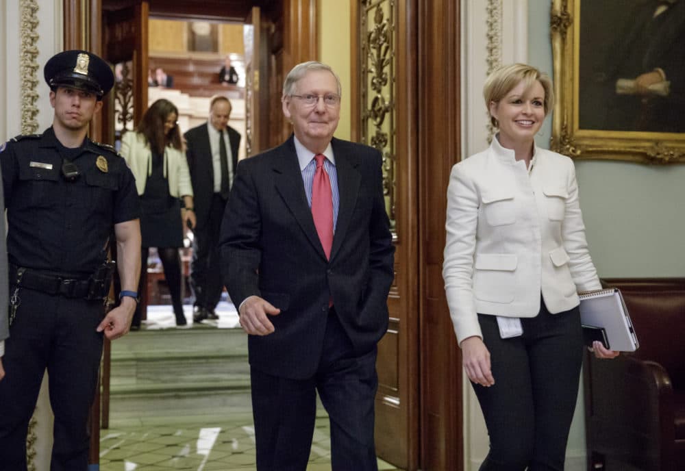 Senate Majority Leader Mitch McConnell, R-Ky., accompanied by staffer Stefanie Hagar Muchow, right, leaves the Senate chamber on Capitol Hill in Washington, Thursday, April 6, 2107, after he led the GOP majority to change Senate rules and lower the vote threshold for Supreme Court nominees from 60 votes to a simple majority in order to advance Neil Gorsuch to a confirmation vote. McConnell also triumphed in blocking any confirmation action on President Obama's choice of Merrick Garland to fill the vacancy on the Supreme Court. (J. Scott Applewhite/AP)