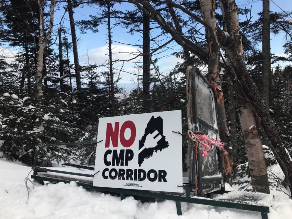 Project opponents make their opinion known on a snowmobiling trail on Coburn Mountain in western Maine. (Fred Bever/Maine Public Radio) 