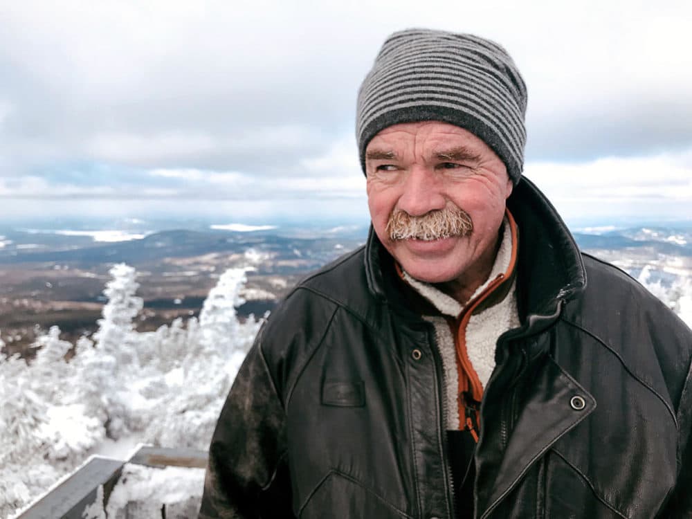 Pete Dostie atop Coburn Mountain in western Maine. (Fred Bever/Maine Public Radio)