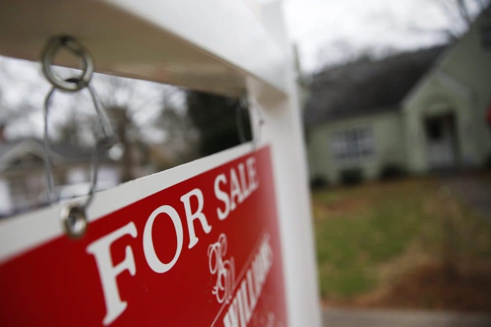 This Jan. 26, 2016 file photo shows a &quot;For Sale&quot; sign hanging in front of an existing home in Atlanta. (John Bazemore/AP)
