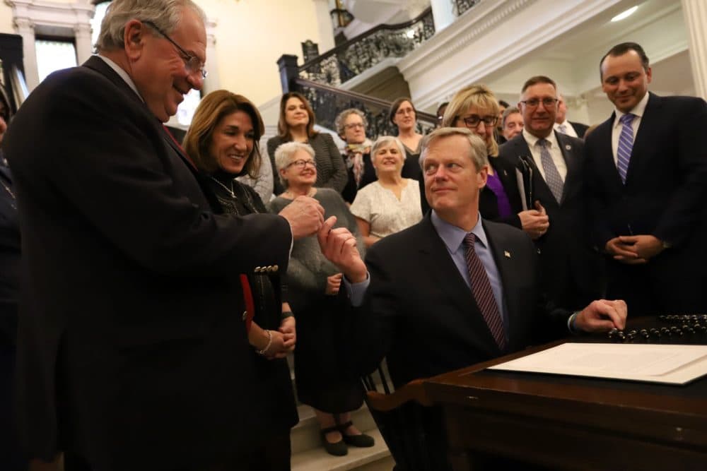 Gov. Charlie Baker held a ceremonial signing event Monday afternoon for a new law setting aside money to cover potential federal funding cuts to family planning clinics that provide abortions or abortion referrals. (Sam Doran/SHNS)