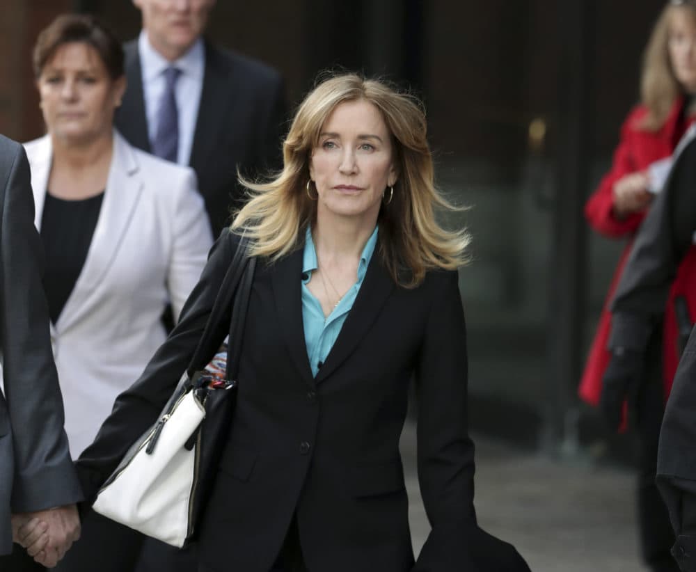 Actress Felicity Huffman departs federal court in Boston on Wednesday. (Charles Krupa/AP)