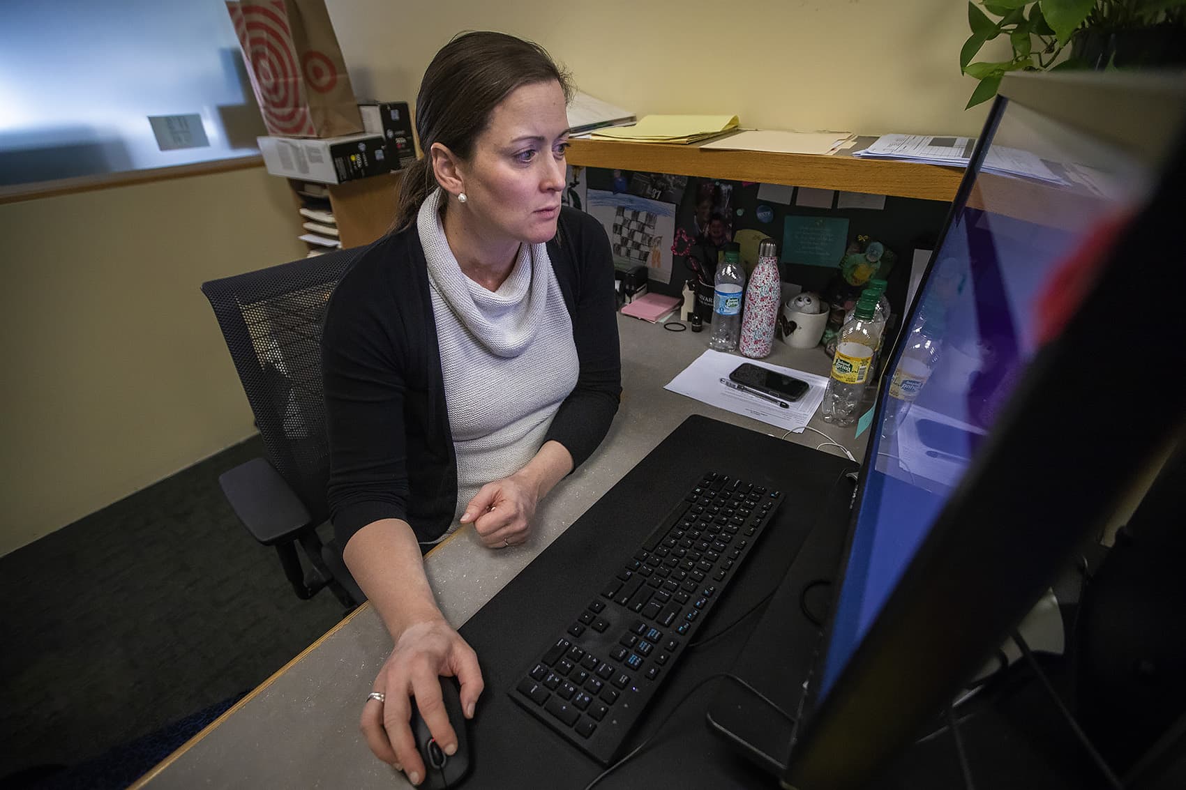 Mary Hurley shops online for the best price for medical procedures offered at different hospitals around the Boston area. (Jesse Costa/WBUR)