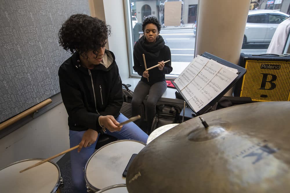 A student plays drums during a Berklee Institute of Jazz and Gender Justice class. (Jesse Costa/WBUR)