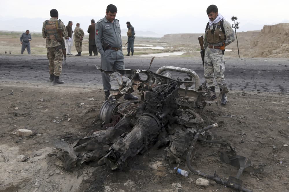 Three American service members and a U.S. contractor were killed when their convoy hit a roadside bomb on Monday near the main U.S. base in Afghanistan, the U.S. forces said. The Taliban claimed responsibility for the attack. (Rahmat Gul/AP)