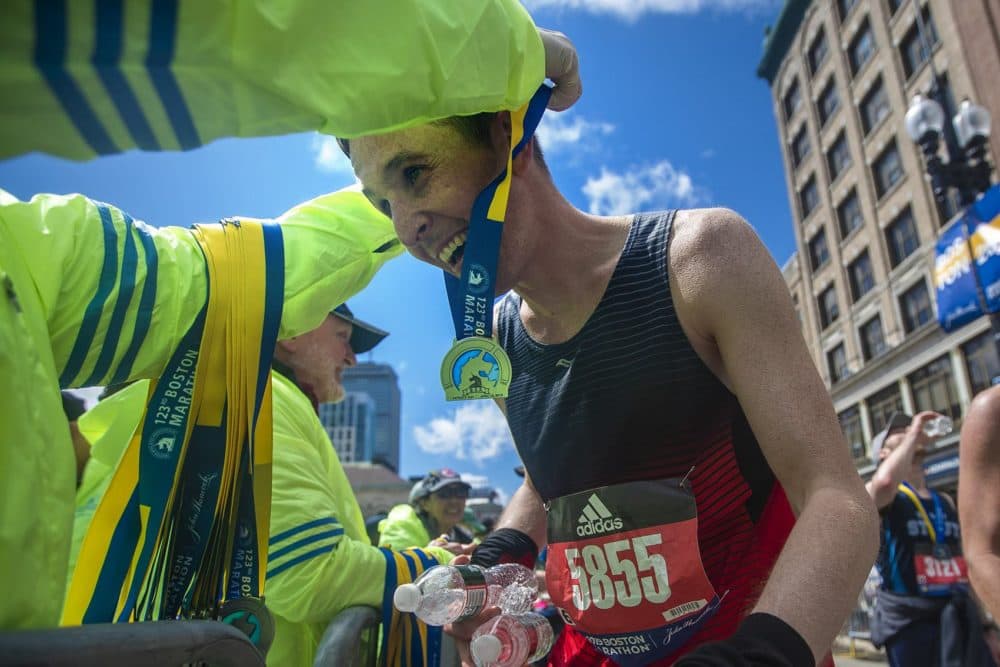 A happy Pete Sullivan receives his Boston Marathon medal. (Jesse Costa/WBUR)