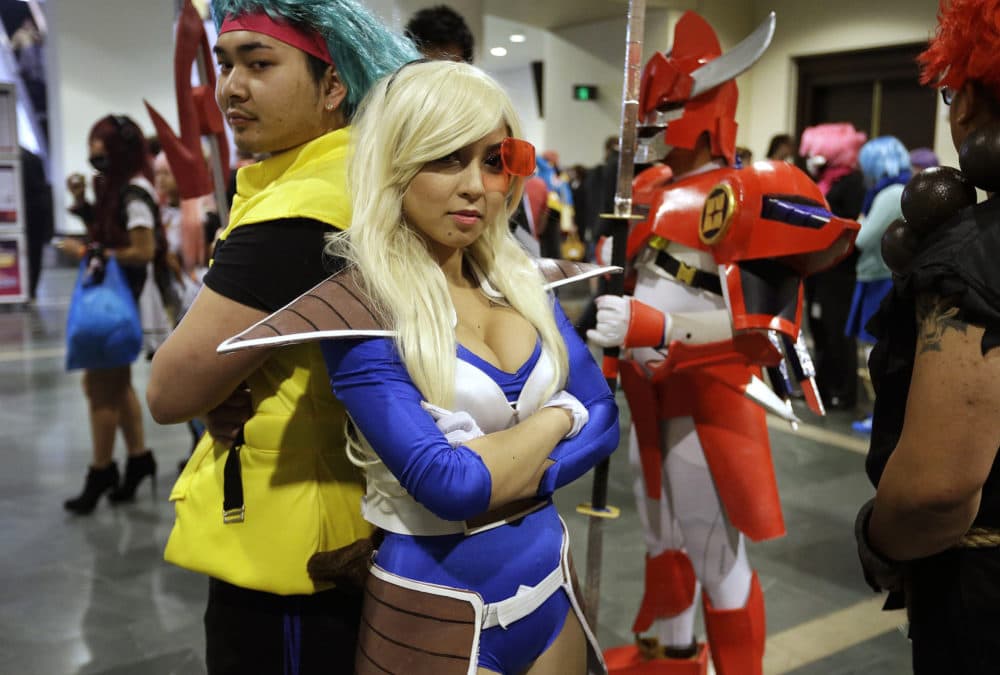 Threa Srey, of Lowell, dressed as Bulma from the Japanese animated series &quot;Dragon Ball Z,&quot; stands with Linda Thach, also of Lowell, in character as Vegeta from &quot;Dragon Ball Z&quot; at the annual three-day Anime Boston in 2015. (Steven Senne/AP)
