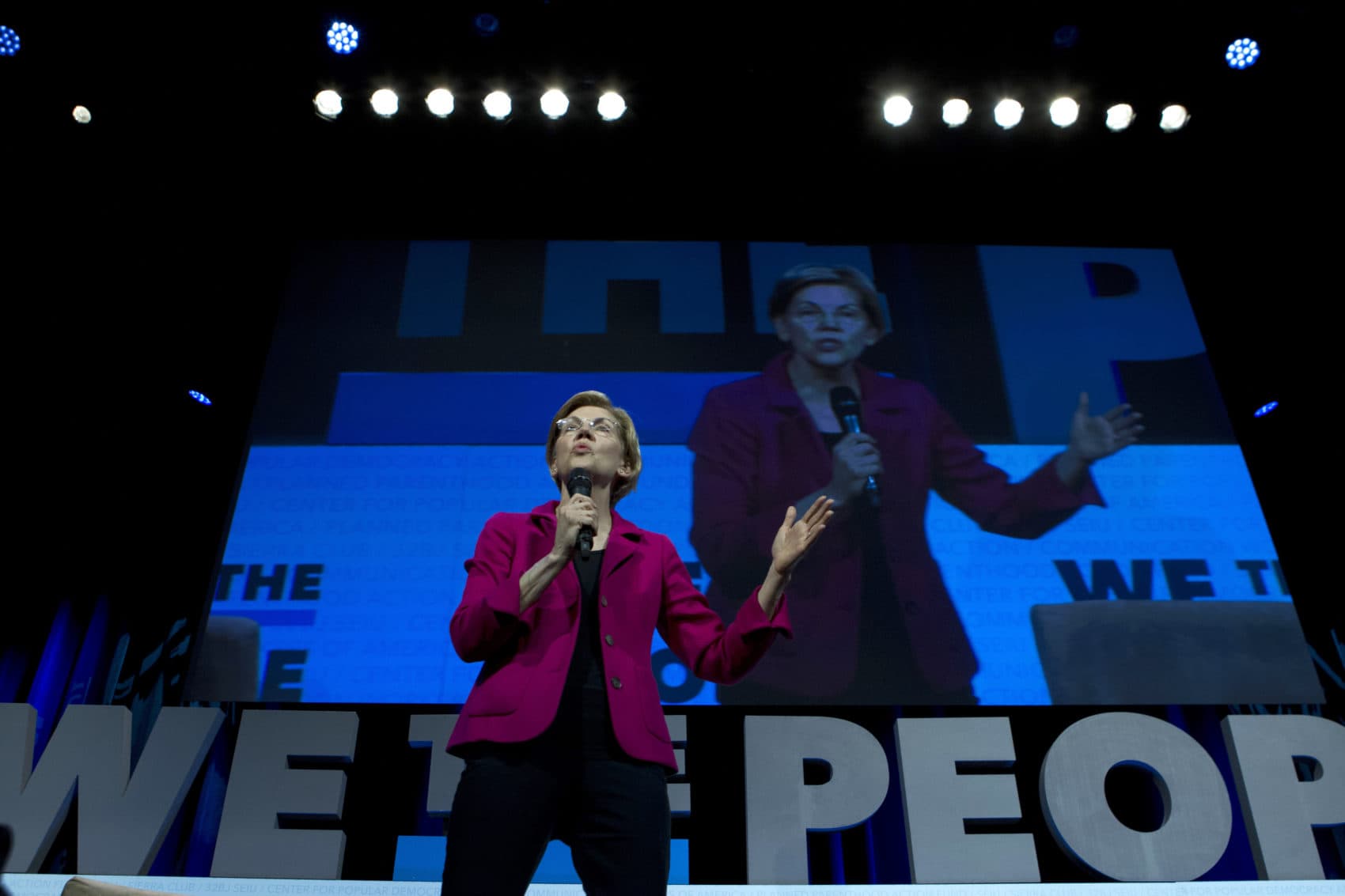 Democratic presidential candidate Sen. Elizabeth Warren, D-Mass., speaks during the We the People Membership Summit, featuring the 2020 Democratic presidential candidates, at the Warner Theater, in Washington on April 1. (Jose Luis Magana/AP)