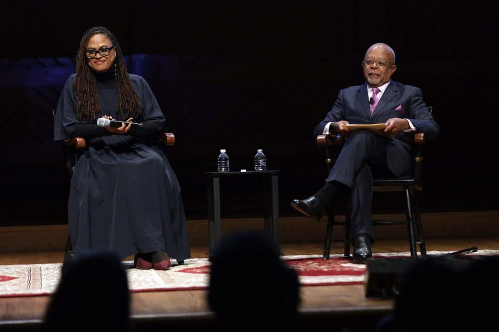 Ava DuVernay, a writer, director, producer, and film distributor, speaks with Henry Louis Gates Jr., Alphonse Fletcher Jr. University Professor and director of the Hutchins Center for African &amp; African American Research at Harvard University, during the Friday evening program of Vision and Justice. (Hadley Green for WBUR)