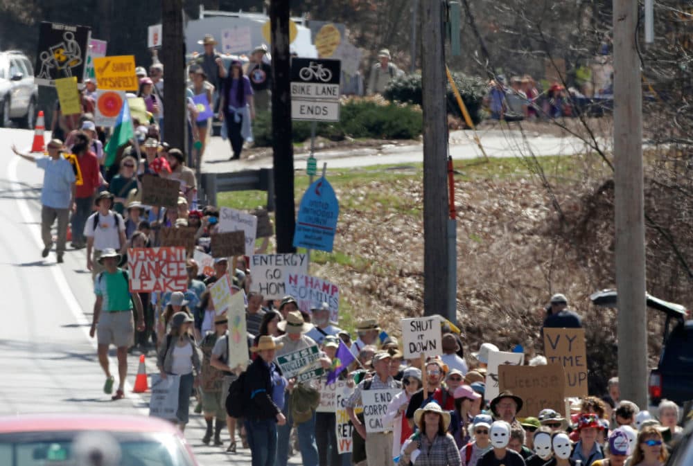 Hundreds of anti-nuclear activists march to the local offices of Vermont Yankee owner Entergy Corp. on March 22, 2012 in Brattleboro, Vermont. (Jim Cole/AP)