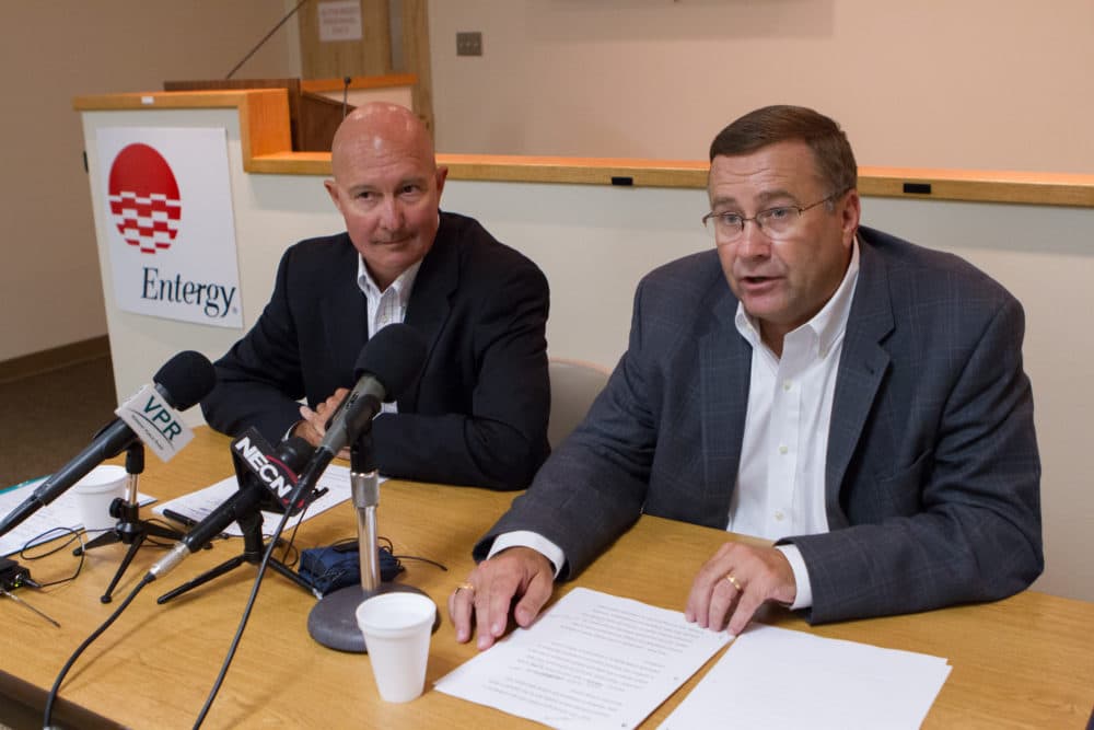 Entergy executives speak at an Aug. 27, 2013, news conference to announce the closing of Vermont Yankee. The power plant shut down in 2014. (Matthew Cavanaugh/AP)