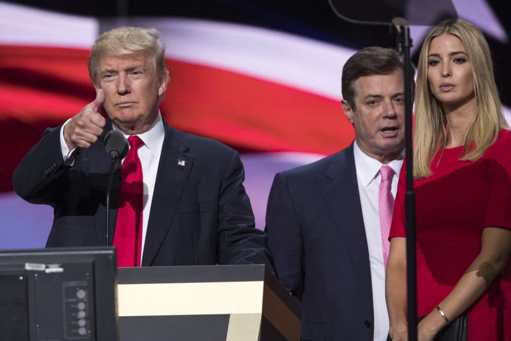 In this July 21, 2016 photo then-Trump Campaign manager Paul Manafort stands between the then-presidential candidate Donald Trump and his daughter Ivanka during a walk through at the Republican National Convention in Cleveland. (Evan Vucci/AP)