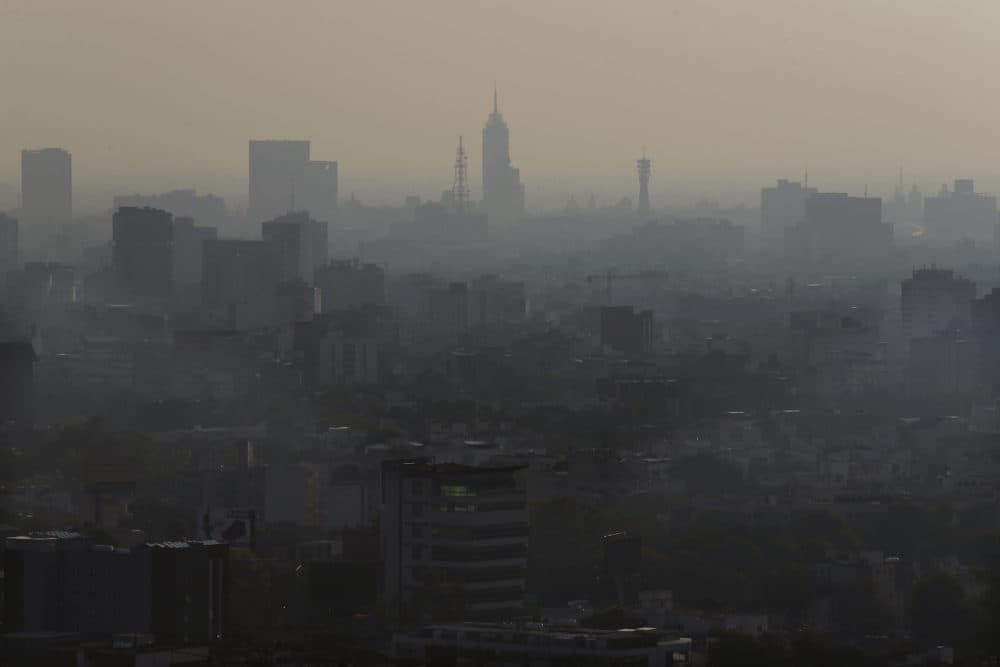 Air pollution creates a haze over Mexico City on May 20, 2018. (Marco Ugarte/AP)