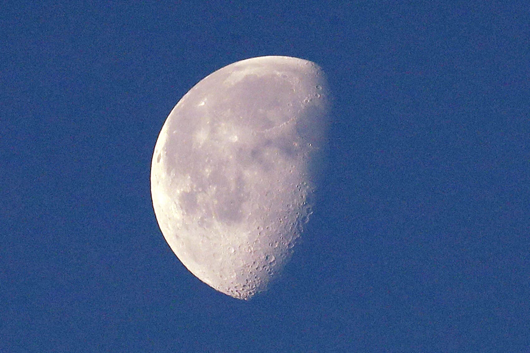 In this photo taken Dec. 27, 2018, the moon, in a waning gibbous phase and briefly visible on an otherwise cloudy day, is seen from Seattle. (Elaine Thompson/AP)