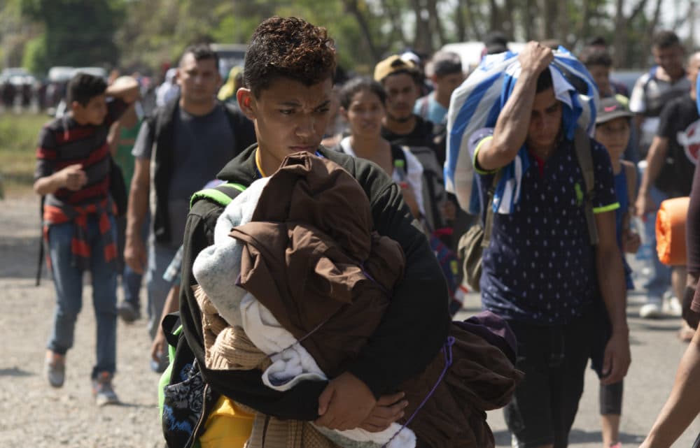 Central American migrants, part of the caravan hoping to reach the U.S. border, move on a road in Tapachula, Chiapas State, Mexico, Thursday, March 28, 2019. (Isabel Mateos/AP)