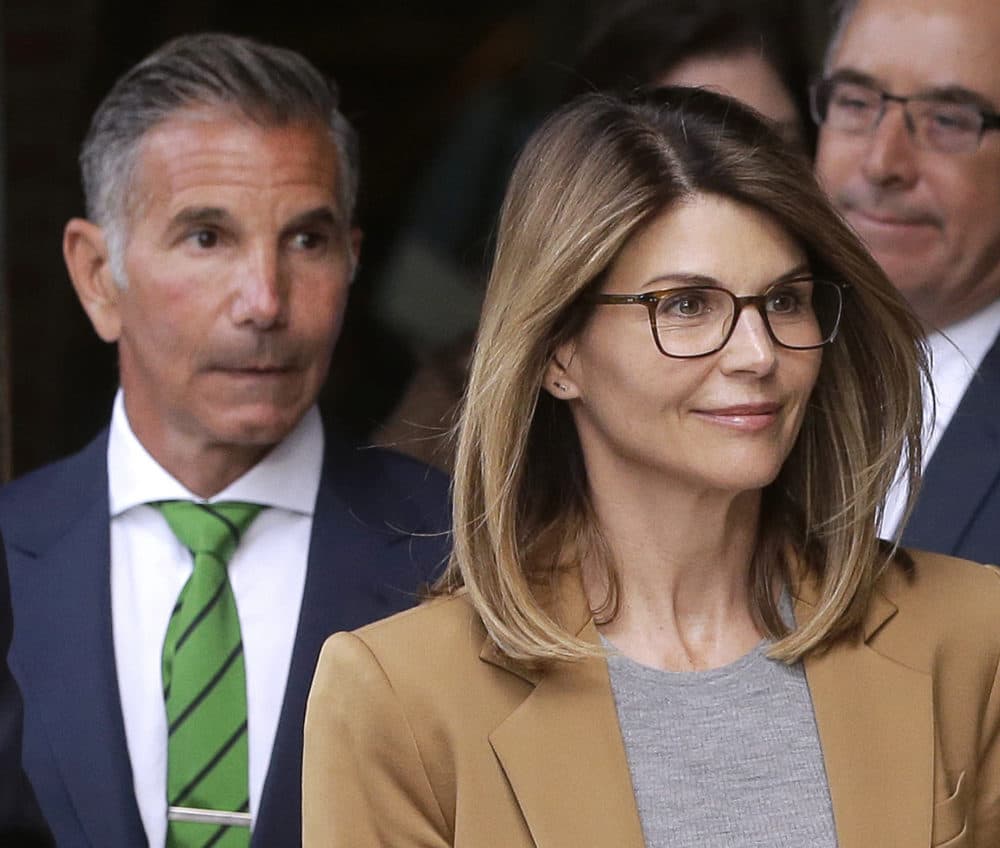 In this April 3, 2019 photo, actress Lori Loughlin, and husband, clothing designer Mossimo Giannulli, depart federal court in Boston after facing charges in a nationwide college admissions bribery scandal. (Steven Senne/AP)