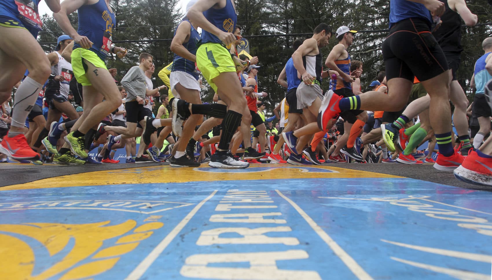 Runners cross the start line. (Stew Milne/AP)