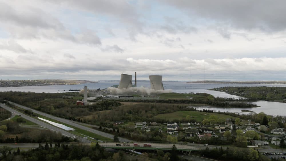 The two 500-foot cooling towers of the former Brayton Point Station in Somerset are demolished with explosives. The plant had burned coal since 1963. (Benjamin Lescault/Grace Barker Health via AP)