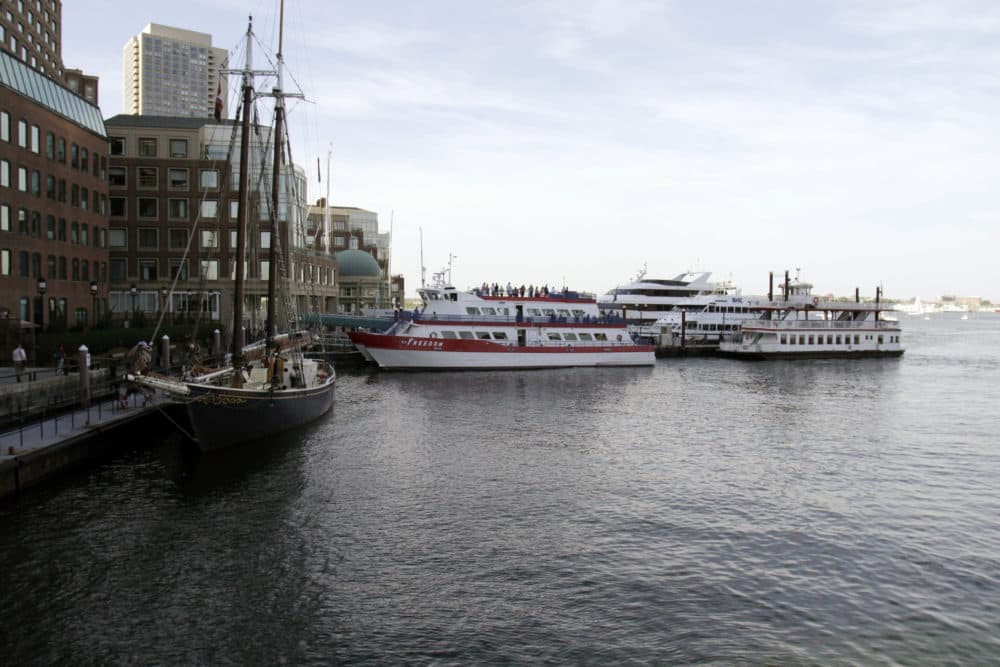 In this 2014 photo, commuter ferry boats sit docked at Rowes Wharf in Boston. (Bill Sikes/AP)