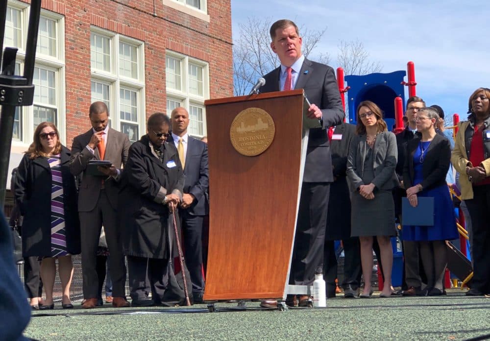 Walsh announced the program Tuesday morning, flanked by education officials, teachers and community leaders. (Max Larkin/WBUR)