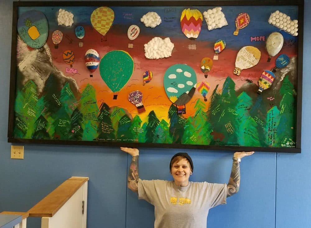 Artist Jessie Mercer shines some color at Pine Ridge School. (Courtesy of Jessie Mercer)