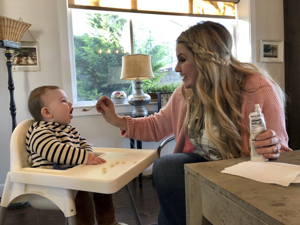 Jocelyn Smith cares for her 11-month-old son, Mason at their home in Camas, Wash., on Jan. 30, 2019. Smith has been afraid to take Mason out of the house during a measles outbreak in southwest Washington because he is too young to receive the measles vaccine. (Gillian Flaccus/AP)