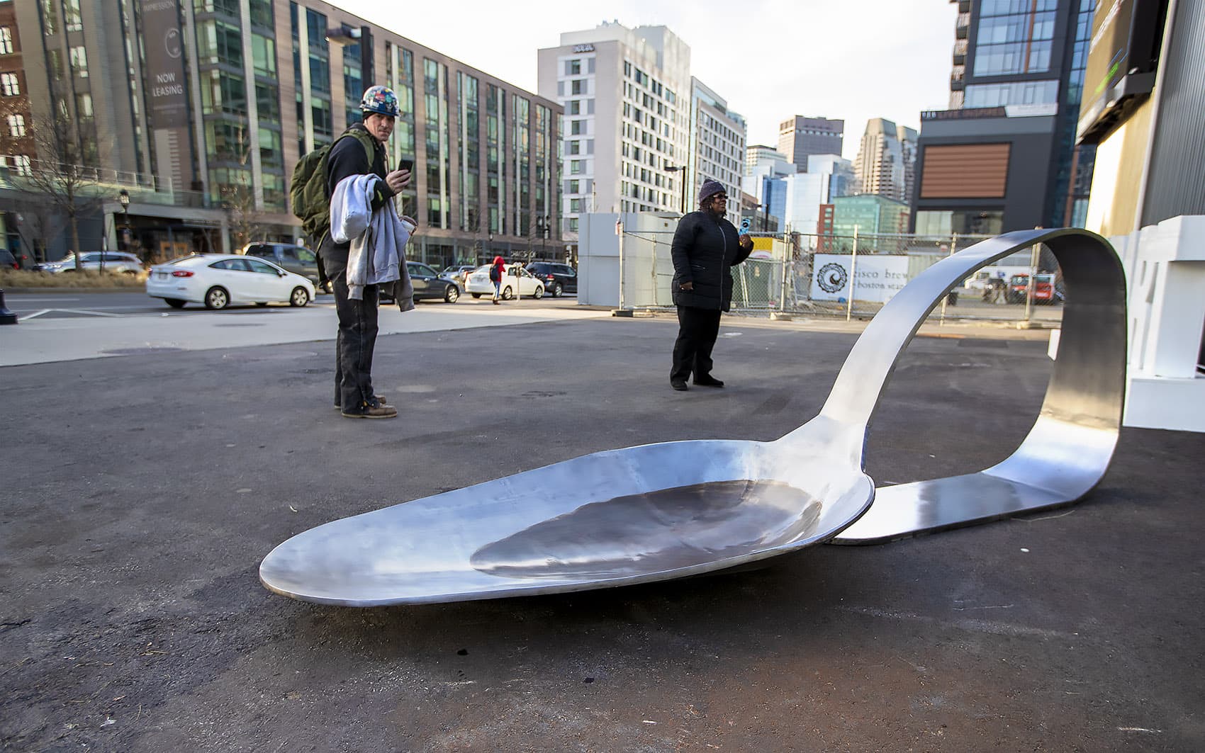 The 800-pound, 11-foot-long steel spoon created by artist Domenic Esposito outside in front of District Hall in the Seaport. (Jesse Costa/WBUR)