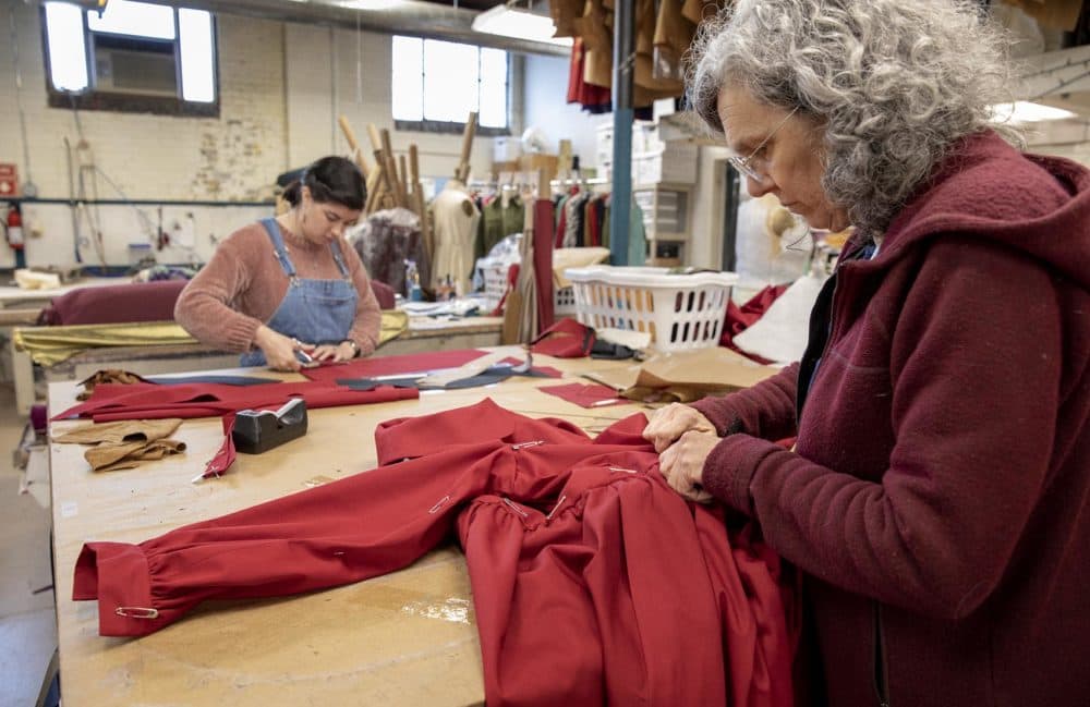 Therese Beck and Lila West work on costumes for the Boston Lyric Opera's production of &quot;The Handmaid's Tale.&quot; (Robin Lubbock/WBUR)