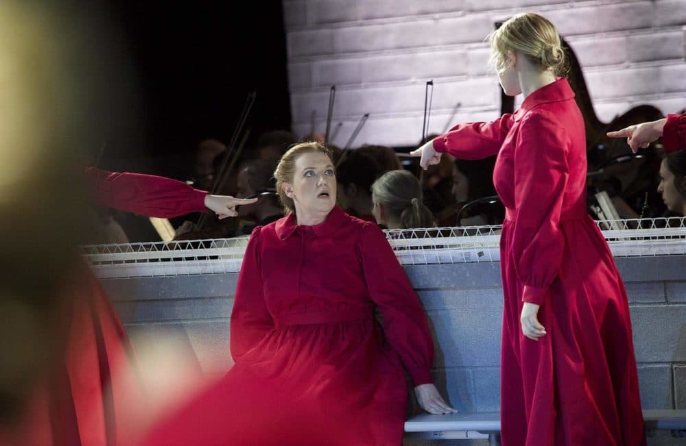 Jennifer Johnson Cano plays Offred, at a rehearsal of &quot;The Handmaid's Tale.&quot; (Robin Lubbock/WBUR)