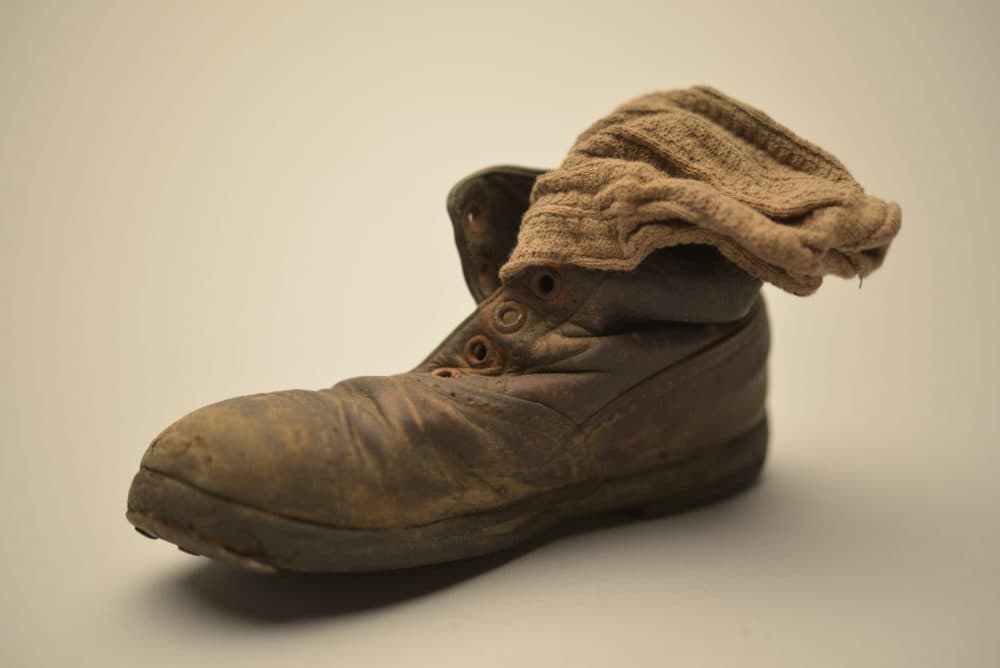 This child’s shoe and sock were found in January 1945 among thousands of others at Auschwitz-Birkenau — abandoned by the Nazis as the Red Army approached. (Courtesy of the Collection of the Auschwitz-Birkenau State Museum, Oświęcim, Poland)