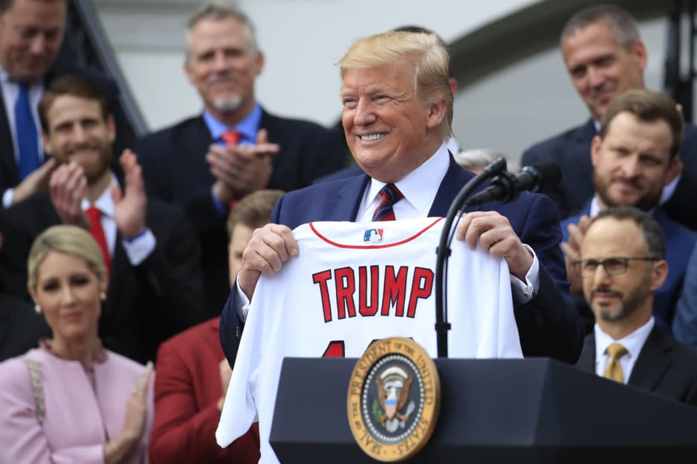 President Trump shows off a Red Sox jersey presented to him during a ceremony welcoming the Boston Red Sox the 2018 World Series baseball champions to the White House on Thursday in Washington. (Manuel Balce Ceneta/AP)