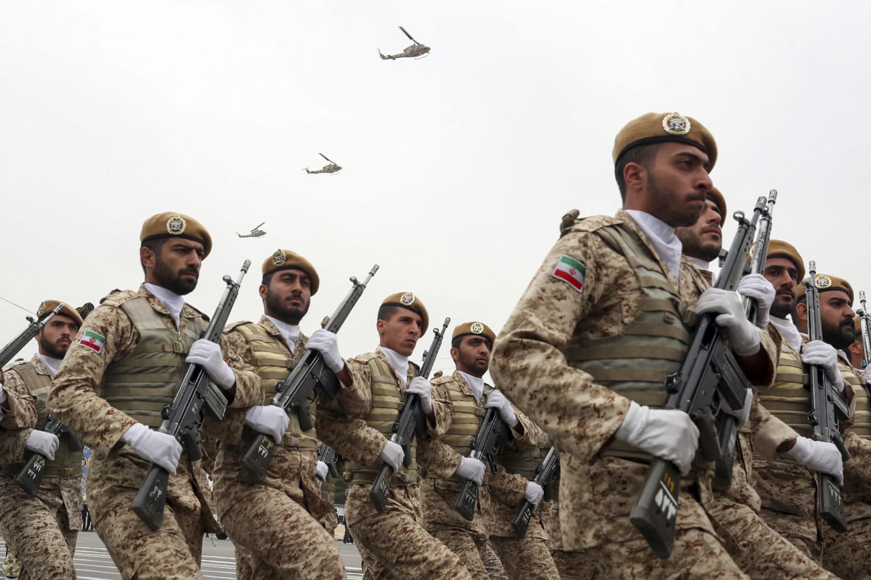 Troops march during the army parade commemorating National Army Day in front of the shrine of the late revolutionary founder Ayatollah Khomeini, just outside Tehran, Iran, Thursday, April 18, 2019. Iran is grappling with U.S. sanctions and the Trump administration's recent terrorism designation of Iran's powerful paramilitary force. (Iranian Presidency Office via AP)