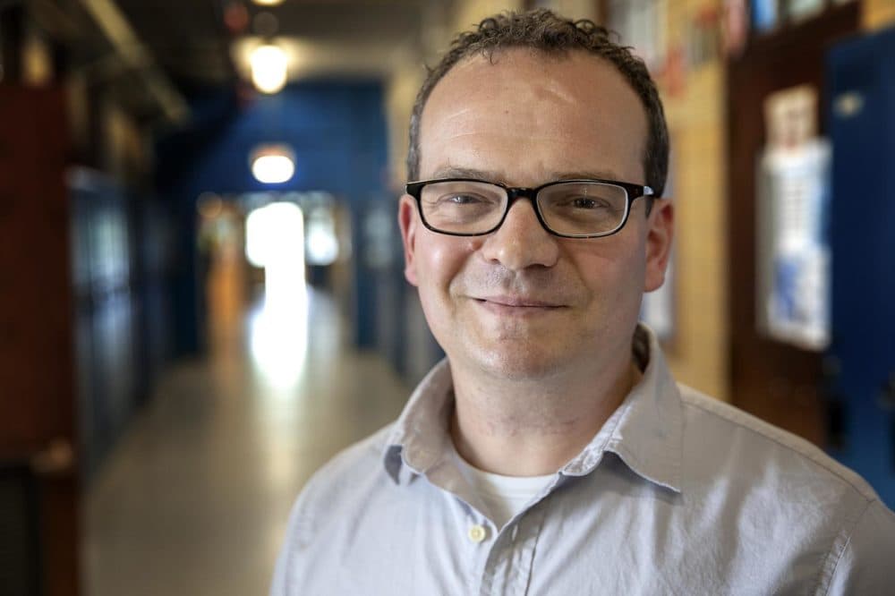 The author in 2019, in the hallway of a Boston public high school. (Robin Lubbock/WBUR)