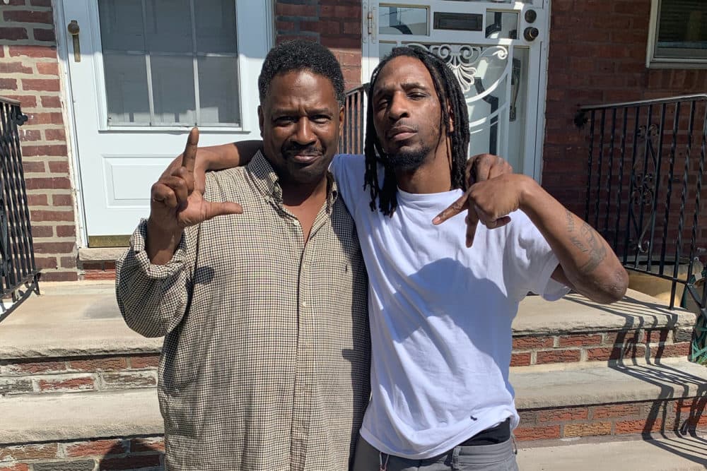 Hassan Bennett (right) stands with his father after being acquitted of second-degree murder. The &quot;LA&quot; sign they are holding up represents Lansdowne Avenue, the Philadelphia neighborhood where they were both raised. (Courtesy of Hassan Bennett)