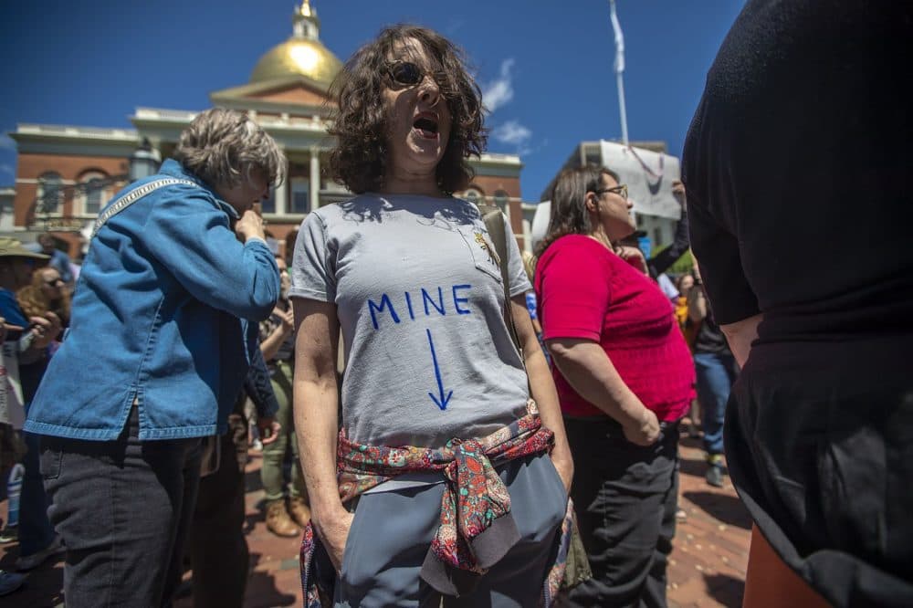 Vivian Gainer, of Jamaica Plain, chants with protesters. (Jesse Costa/WBUR)