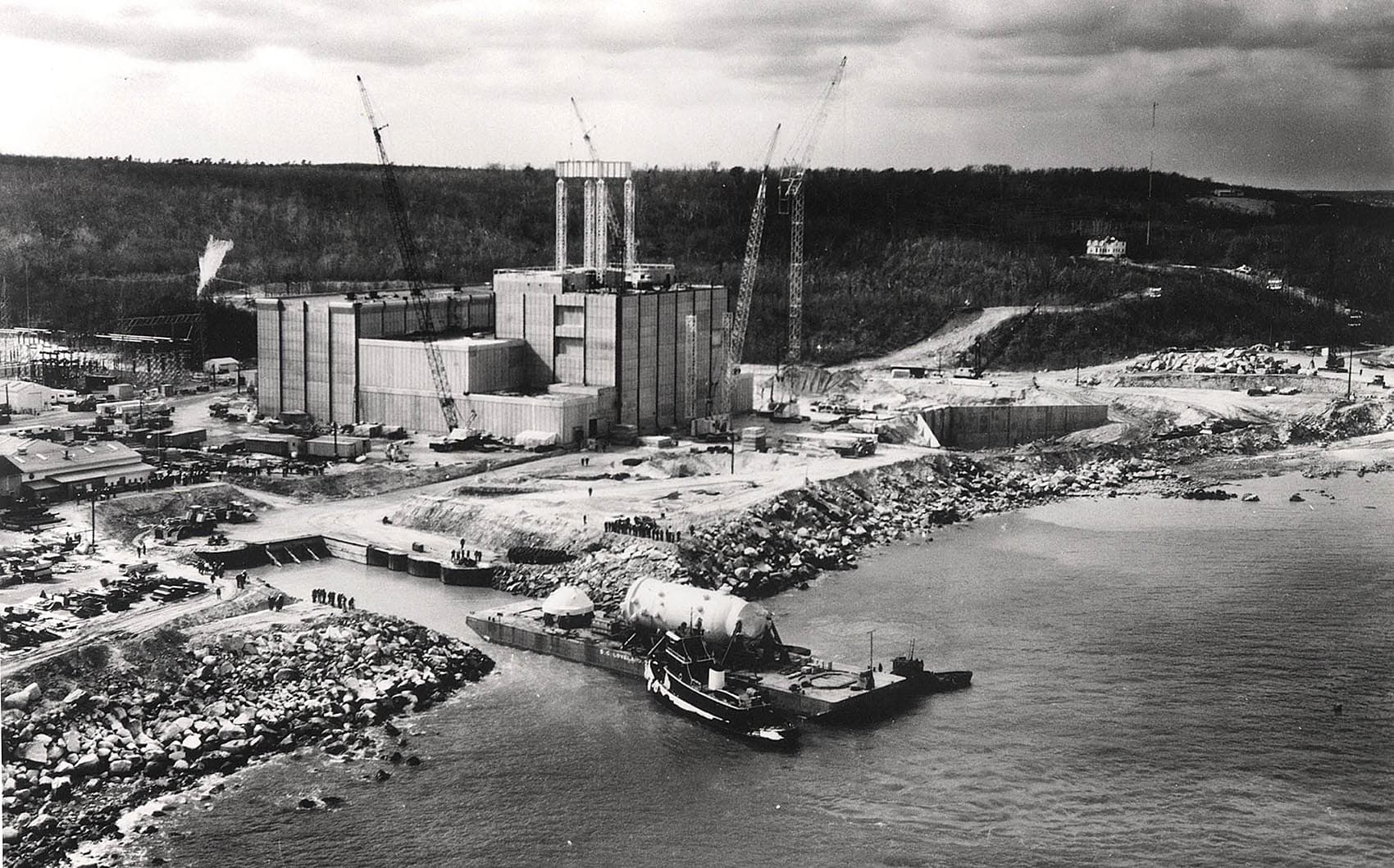 In this photo, circa 1971, the 525-ton, 65-foot-tall reactor vessel arrives by boat at the Pilgrim Nuclear Power Station. (Courtesy U.S. Department of Energy)