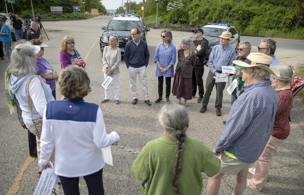 Activists form a circle outside the gates of Pilgrim Nuclear Power Station to share their thoughts on the day as the plant ceased power production. (Robin Lubbock/WBUR)