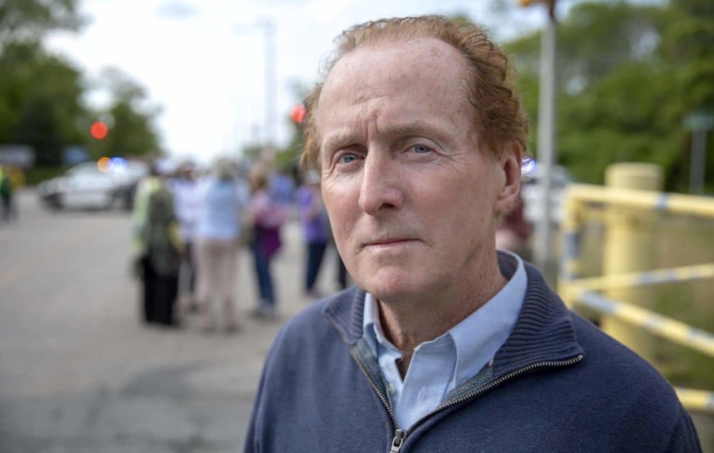 Activist Gerry Londergan gathered at the entrance to the Pilgrim nuclear plant just before it closed. (Robin Lubbock/WBUR)