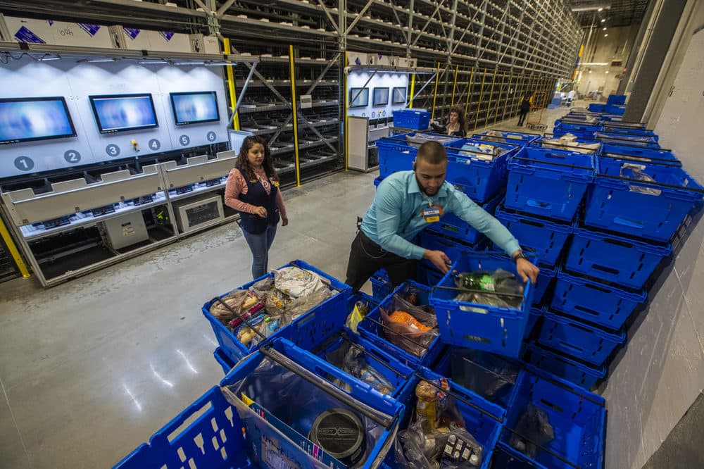 Walmart associates setting up orders for grocery pickup. (Jesse Costa/WBUR)