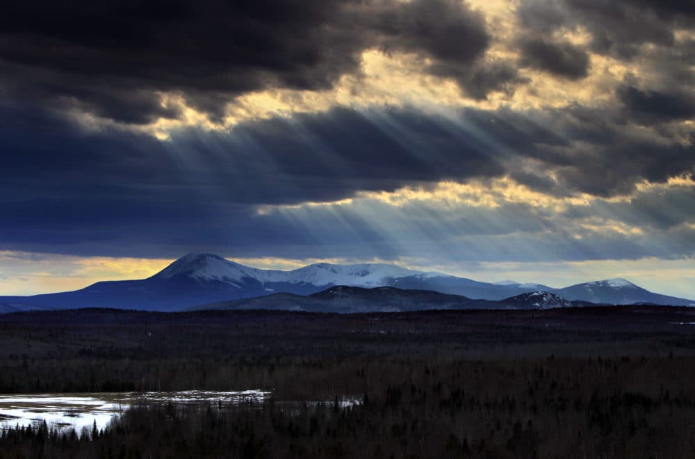 In this 2010 photo, sun rays filter through clouds over 5,267-foot Mount Katahdin in Maine's Baxter State Park. (Robert F. Bukaty/AP)