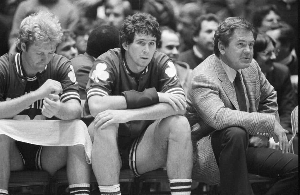 Rick Robey, center, sits on the Celtics bench with head coach Bill Fitch and Larry Bird. (Peter Morgan/AP)