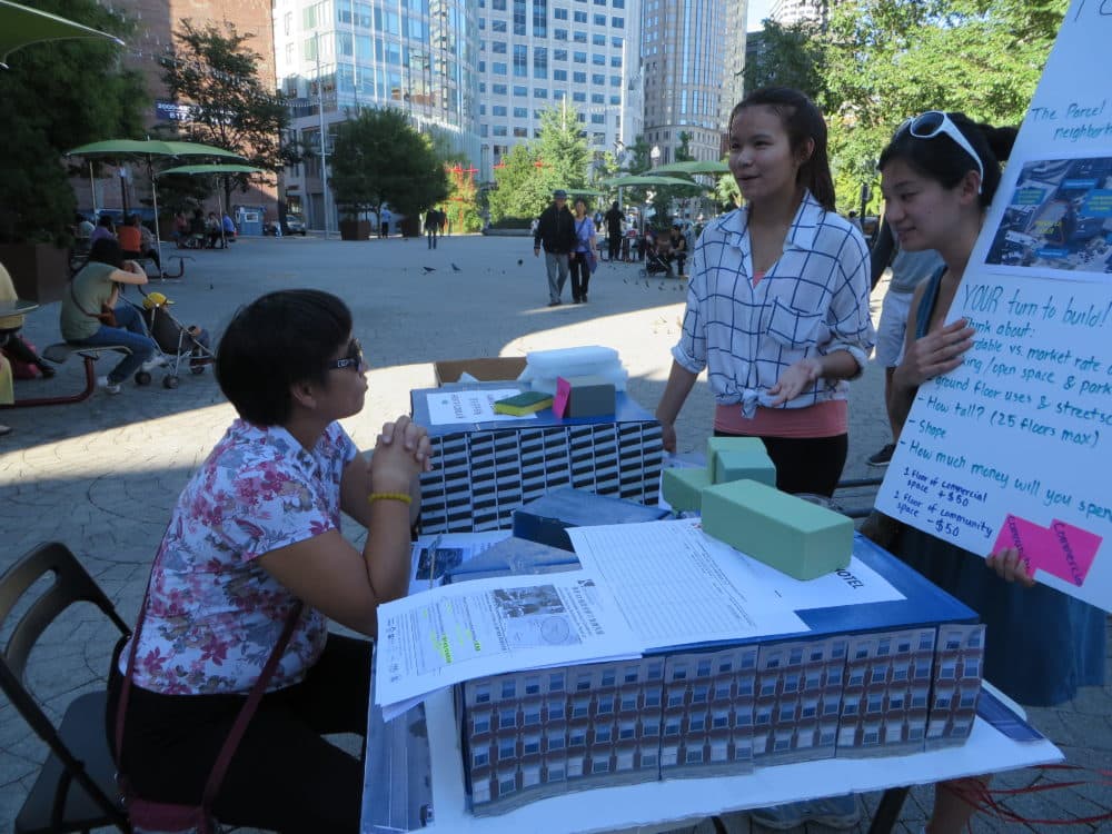 The author, standing in a white shirt, while working to educate residents about Parcel 12 in Mary Soo Hoo Park in Chinatown. (Courtesy)