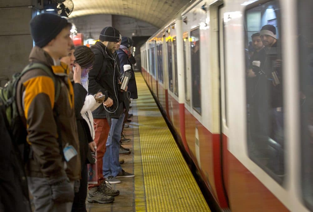In this 2015 file photo, people wait to board a Red Line train at Porter Square MBTA station. (Robin Lubbock/WBUR)