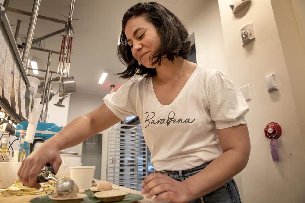 Baravena's Nayla Bezares arranges some different flavors of helados. (Robin Lubbock/WBUR)