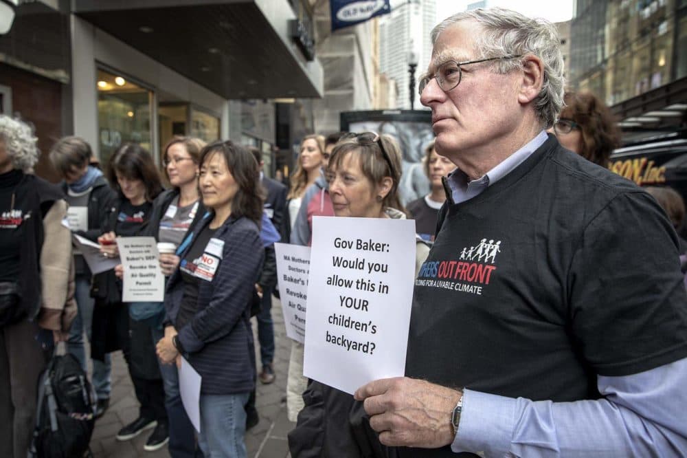 Protesters call on Gov. Charlie Baker to halt development of the Weymouth gas compressor station during a rally in May. (Robin Lubbock/WBUR)