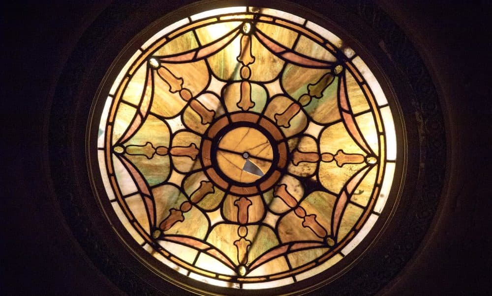 One of the colored glass ceiling lights in the auditorium of the Strand Theatre. (Robin Lubbock/WBUR)