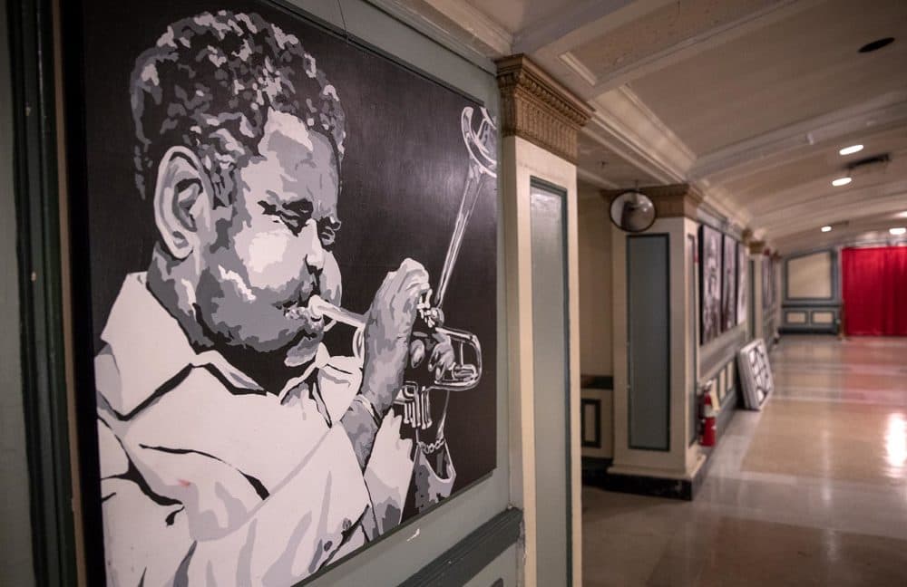 Jazz trumpeter Dizzy Gillespie is one of the many artists who played at the The Strand Theatre whose portraits now line the walls of the theater foyer. (Robin Lubbock/WBUR)